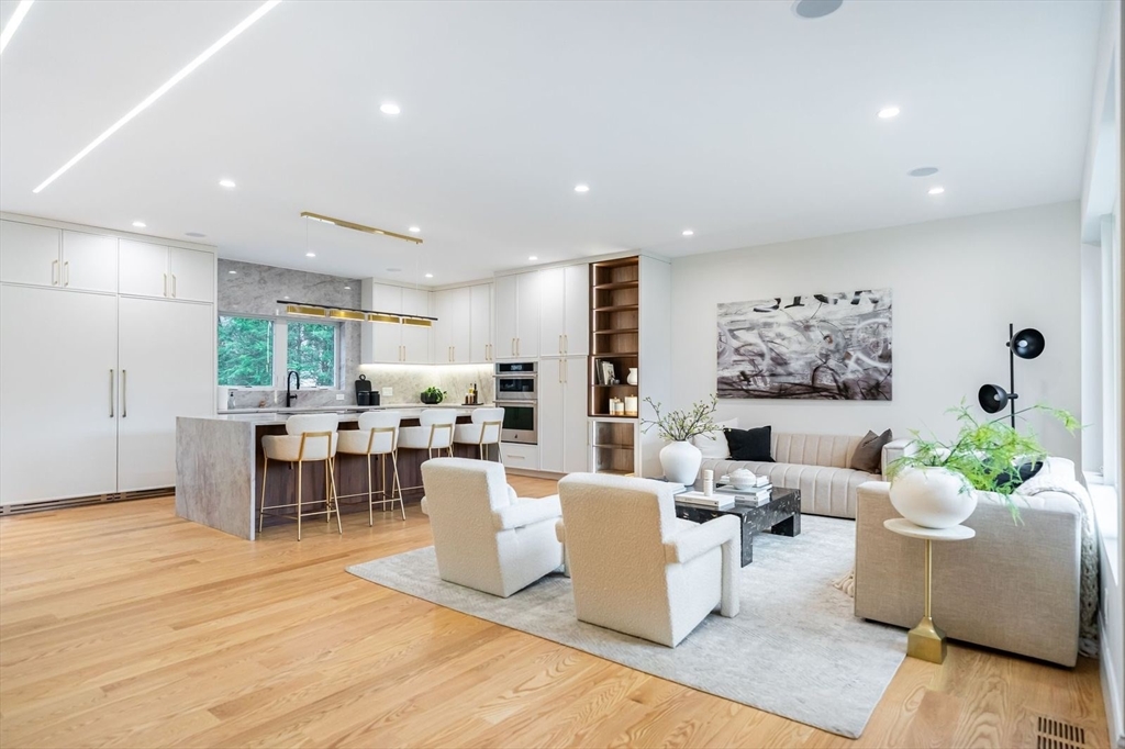 98 Hunnewell Street Needham, MA 02494 - Photo 13 of 36 a living room with furniture kitchen view and a large window