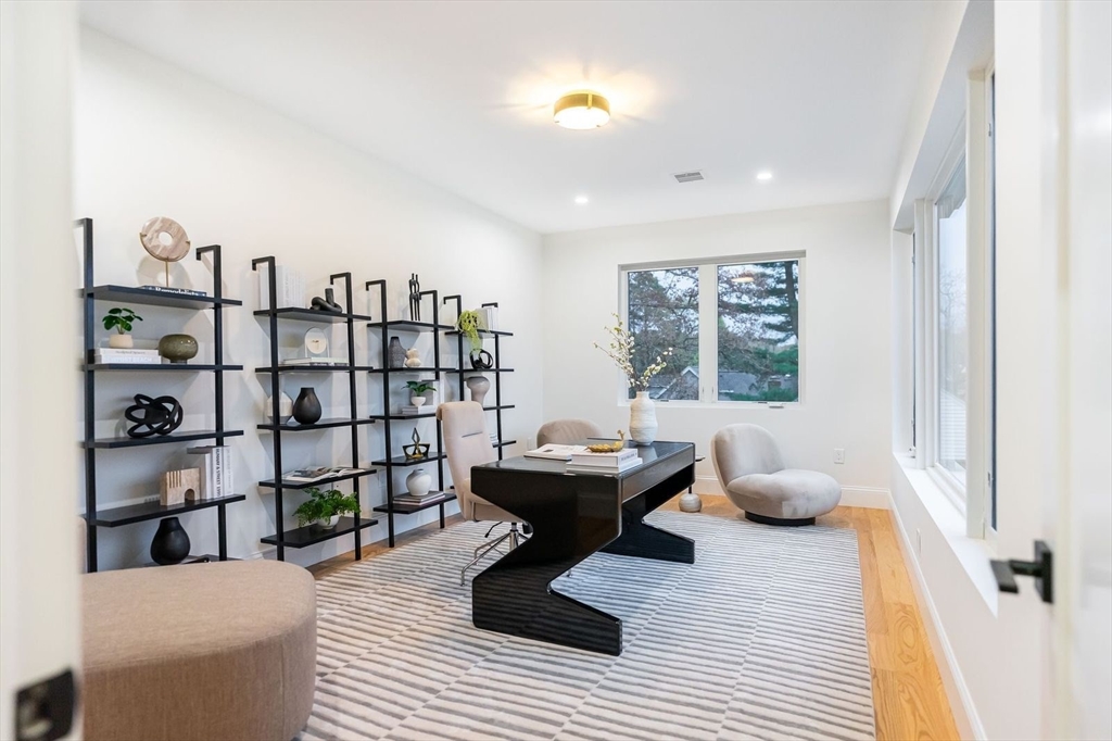 98 Hunnewell Street Needham, MA 02494 - Photo 23 of 36 a living room with furniture and white walls