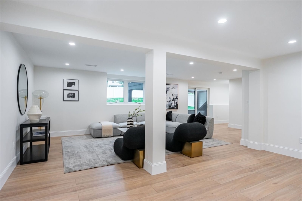 98 Hunnewell Street Needham, MA 02494 - Photo 26 of 36 a view of a living room kitchen and a wooden floor