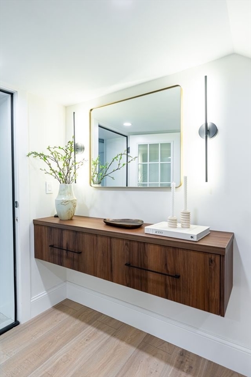 98 Hunnewell Street Needham, MA 02494 - Photo 36 of 36 a bathroom with a sink and a mirror