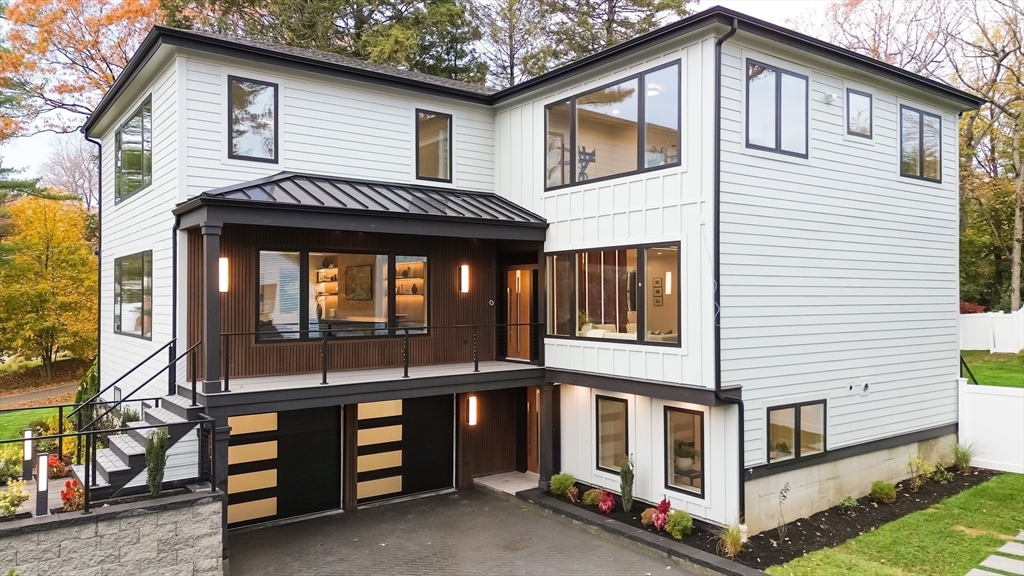 98 Hunnewell Street Needham, MA 02494 - Photo 4 of 36 a view of a house with a yard