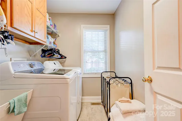 a living room with furniture gym equipment and a flat screen tv