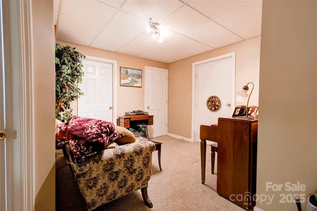 a bedroom with furniture and a wooden floor