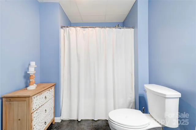 an aerial view of a house with swimming pool and garden view