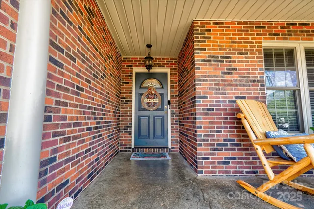 a view of front door of house with stairs