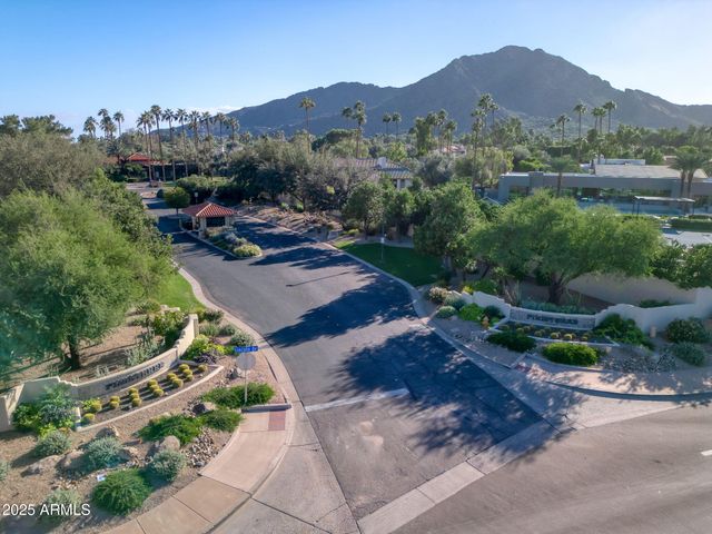a view of a town with mountains in the background