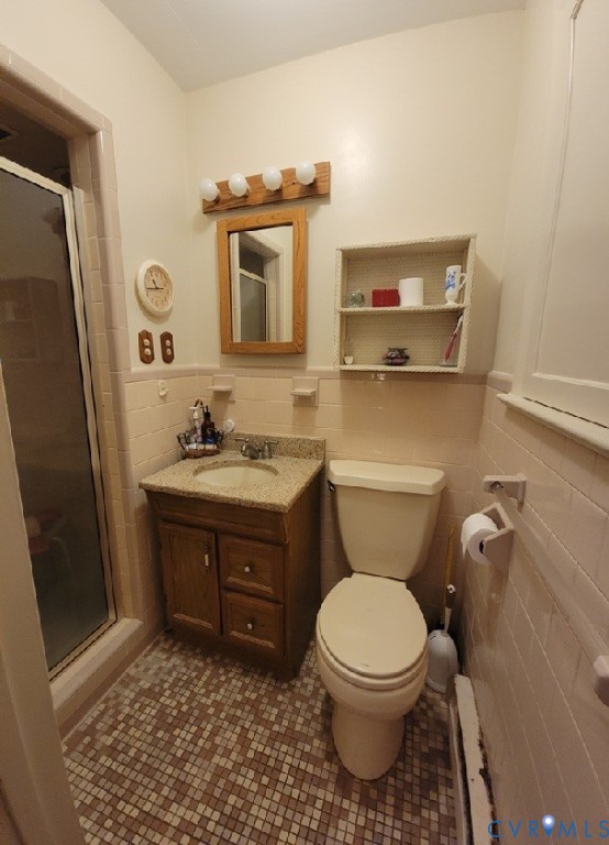 8241 Virginia Avenue West Point, VA 23181 - Photo 13 of 18 a bathroom with a toilet sink and mirror