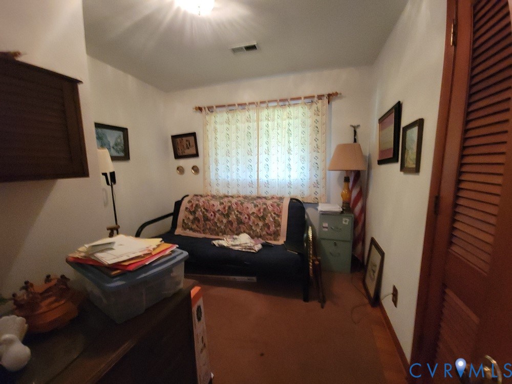8241 Virginia Avenue West Point, VA 23181 - Photo 14 of 18 a living room with furniture and a flat screen tv