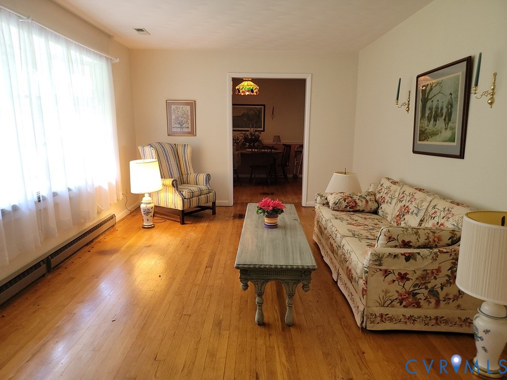 8241 Virginia Avenue West Point, VA 23181 - Photo 7 of 18 a living room with furniture and wooden floor