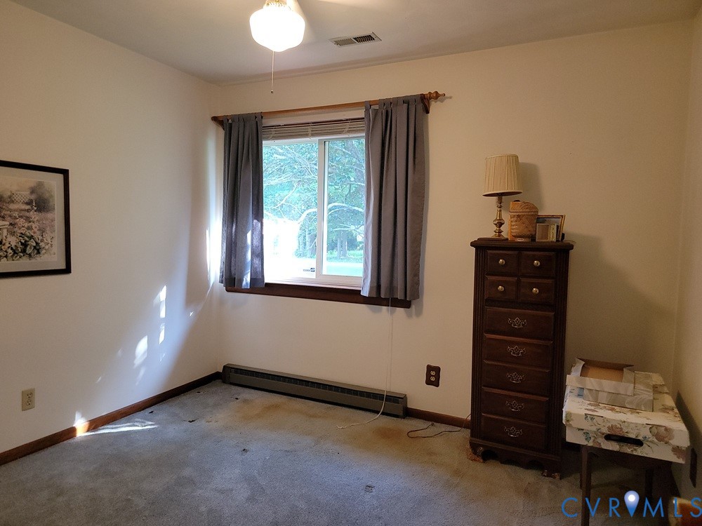 8241 Virginia Avenue West Point, VA 23181 - Photo 8 of 18 a view of an empty room with a window