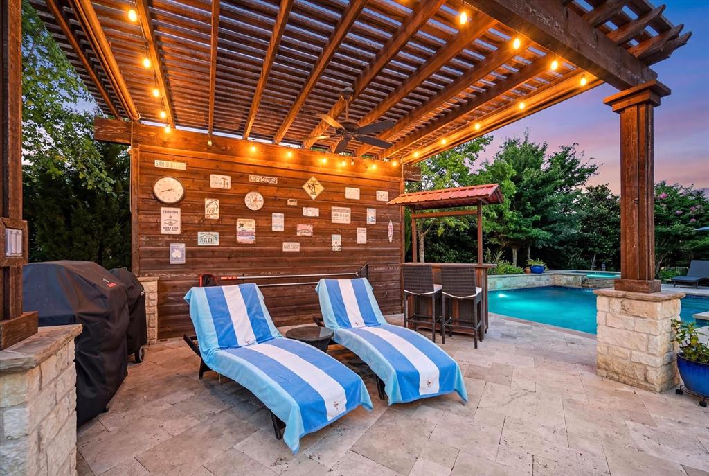 6656 Roughleaf Ridge Road Flower Mound, TX 76226 - Photo 32 of 40 a view of patio with a table and chairs