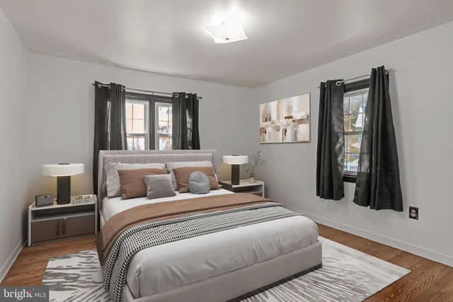 a bedroom with a large bed and a window