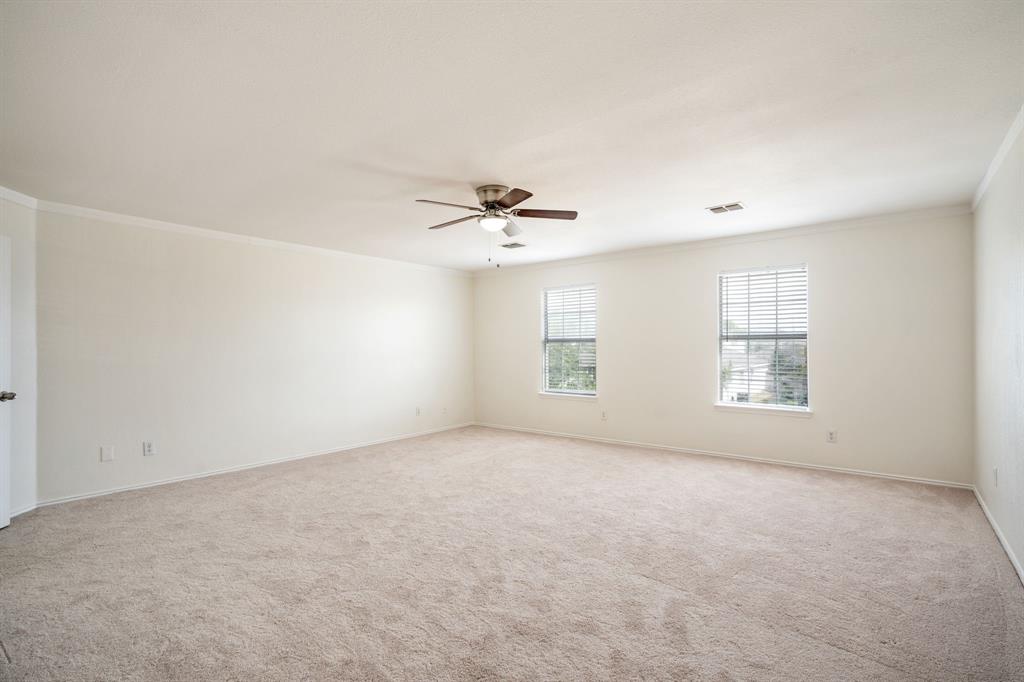 1626 White Oak Road Anna, TX 75409 - Photo 28 of 30 an empty room with a ceiling fan and window