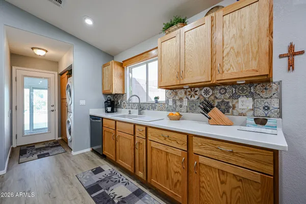 a kitchen with sink cabinets and window