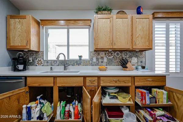 a view of electric appliances and cabinets in a room