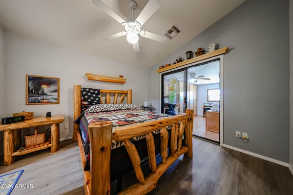 a bed room with a bed and a chandelier