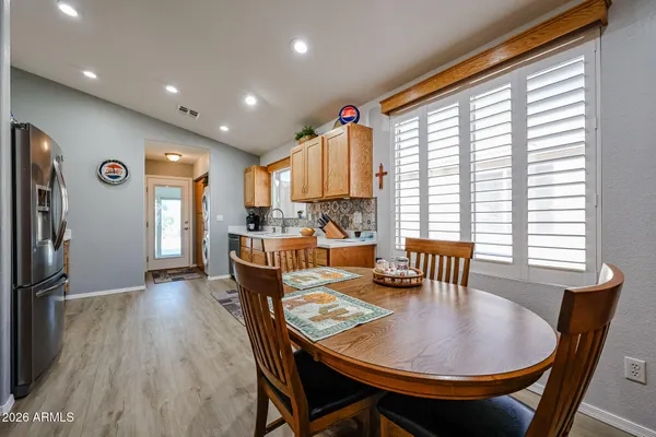 a dining room with furniture and window