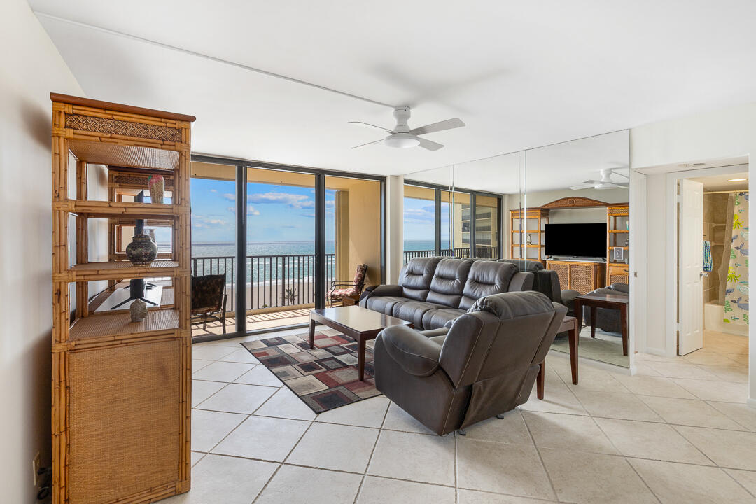 400 Ocean Trail Way, Unit 1108 Jupiter, FL 33477 - Photo 10 of 41 a living room with furniture and a flat screen tv