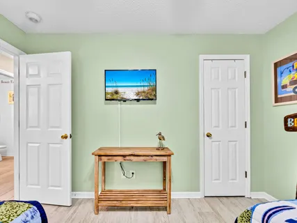 a bathroom with a sink a mirror and a shower