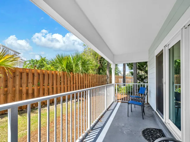 a view of a porch with wooden floor