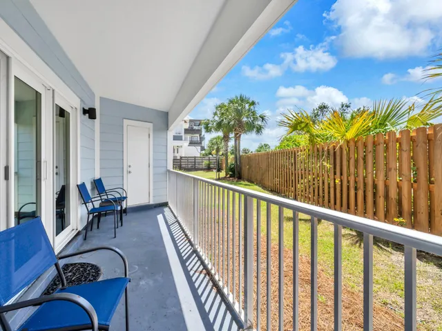 a view of a balcony with chairs