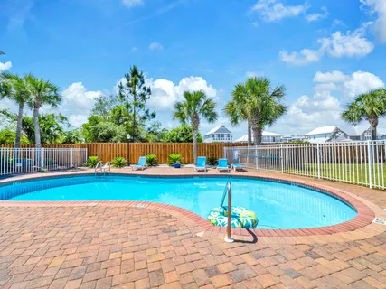 a view of a swimming pool and a yard