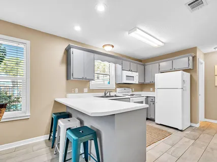 a kitchen with appliances and cabinets