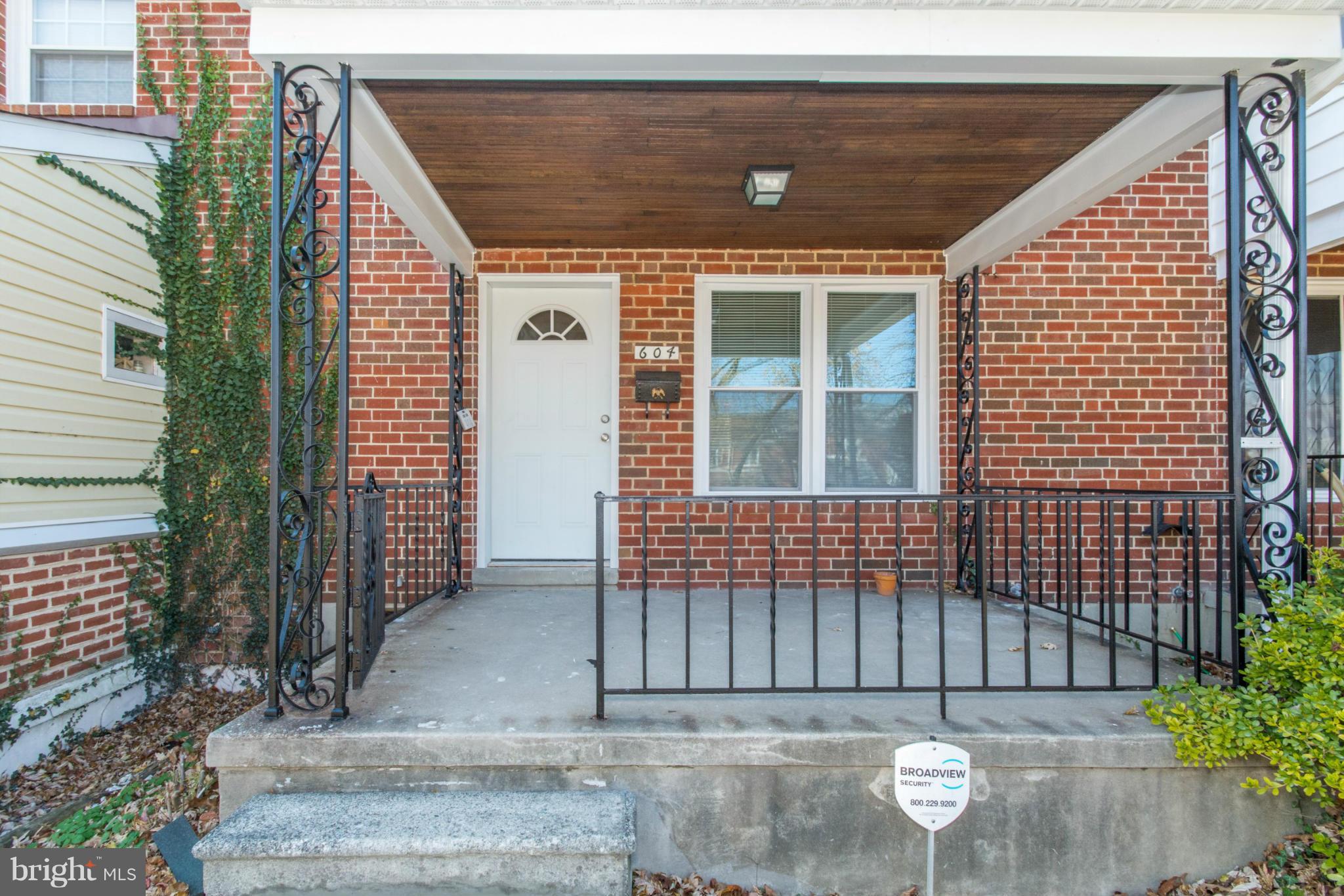 604 Brisbane Road Baltimore, MD 21229 - Photo 2 of 30 a view of a house with a small backyard
