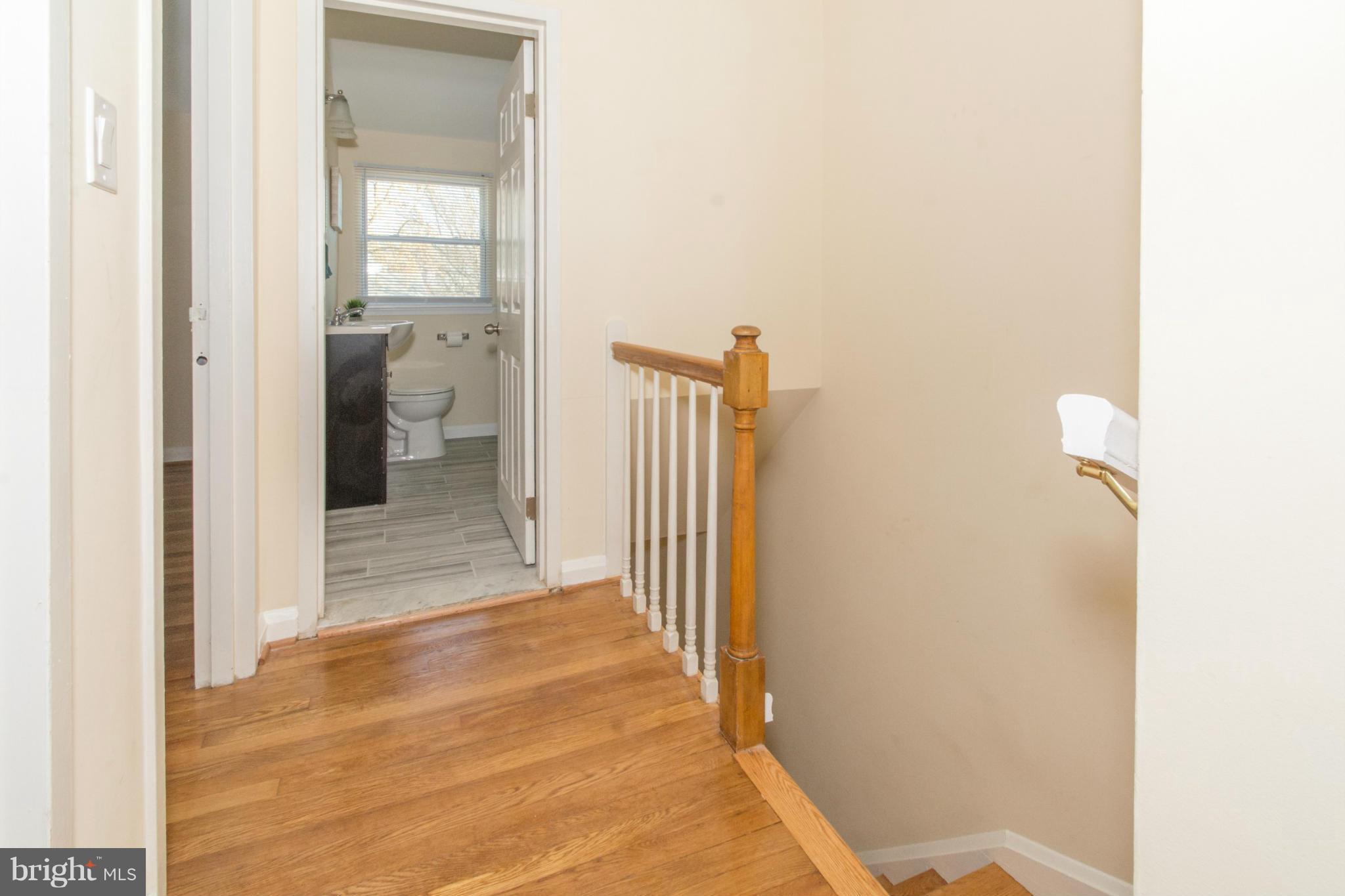 604 Brisbane Road Baltimore, MD 21229 - Photo 13 of 30 a view of a bathroom from a hallway