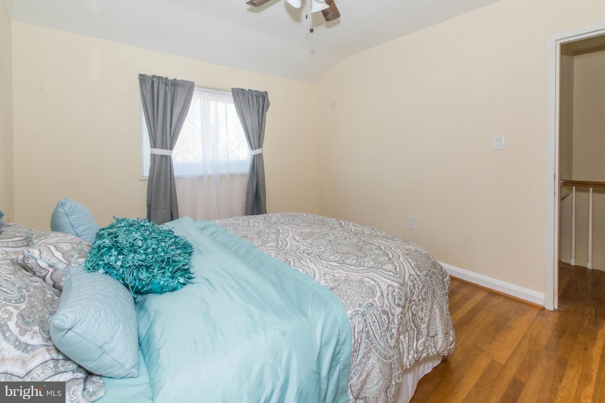 604 Brisbane Road Baltimore, MD 21229 - Photo 15 of 30 a bedroom with a bed and a window