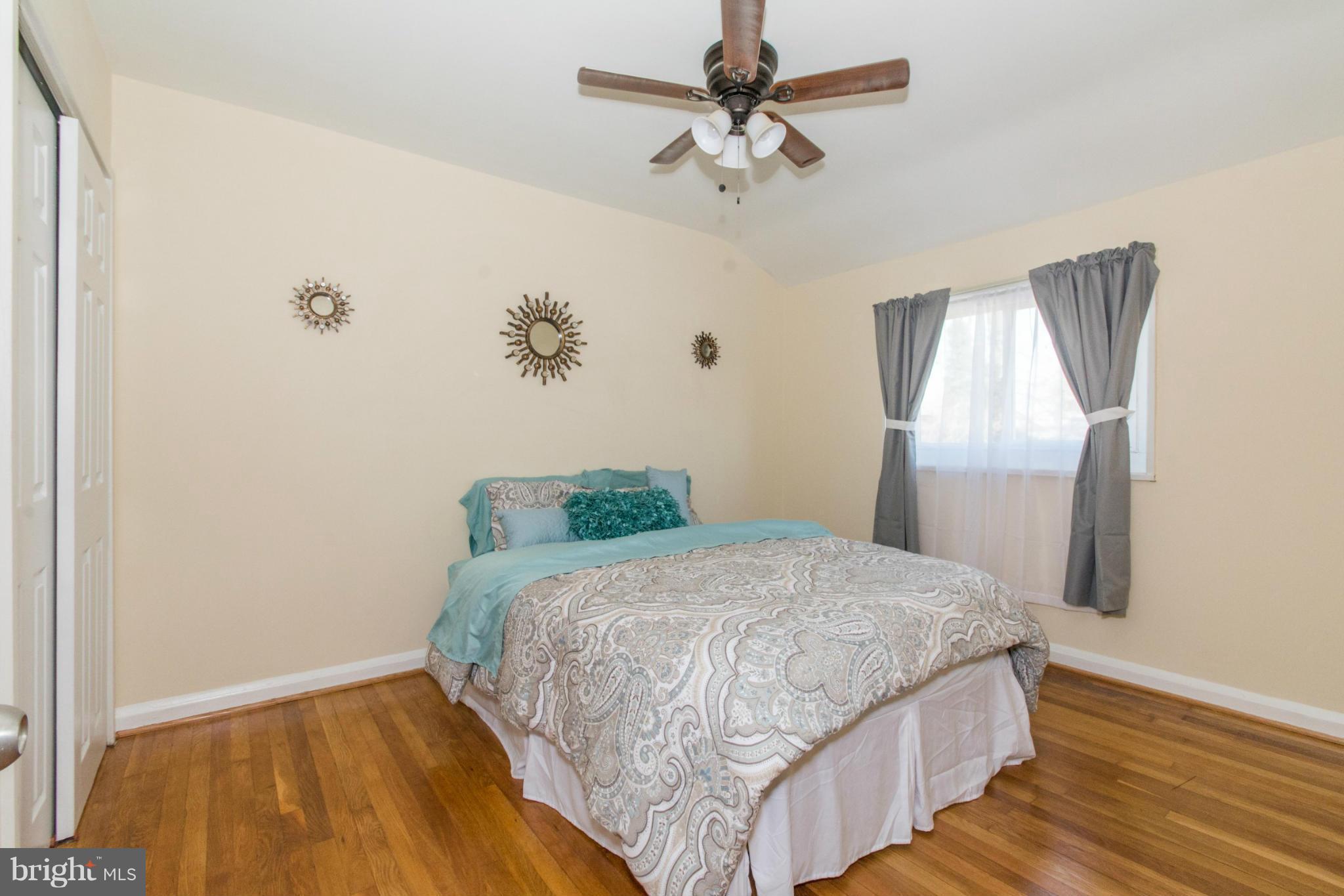604 Brisbane Road Baltimore, MD 21229 - Photo 17 of 30 a bedroom with a bed and a window