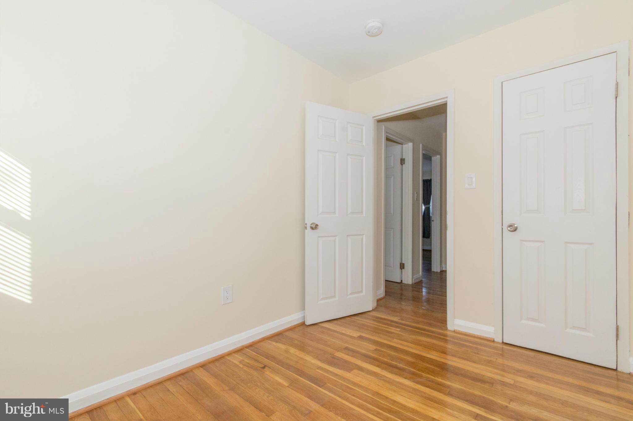 604 Brisbane Road Baltimore, MD 21229 - Photo 18 of 30 a view of an empty room with wooden floor