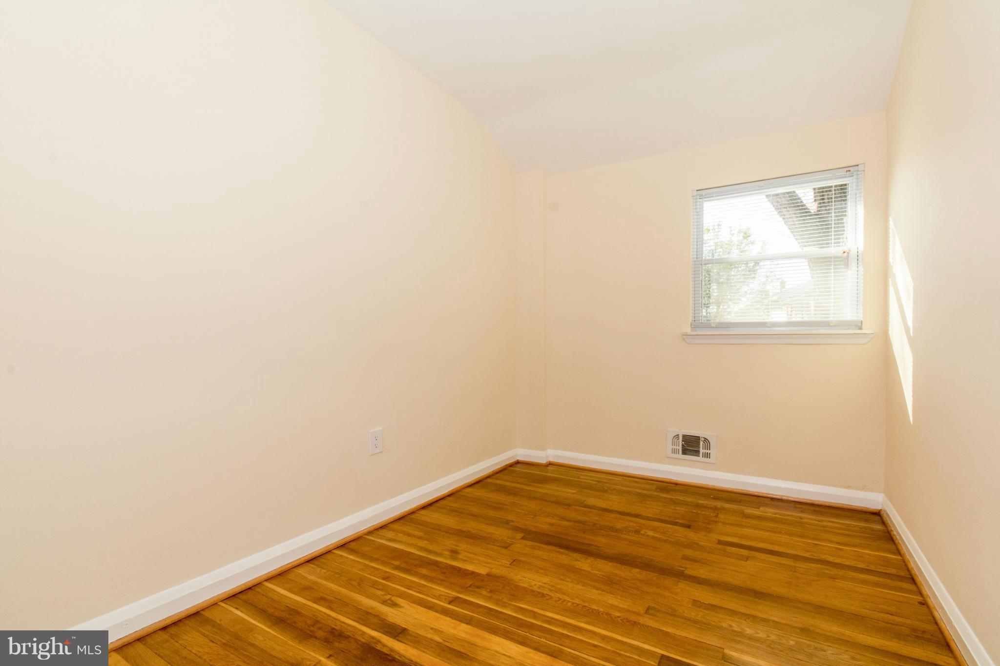604 Brisbane Road Baltimore, MD 21229 - Photo 20 of 30 a view of a room with wooden floor and a window