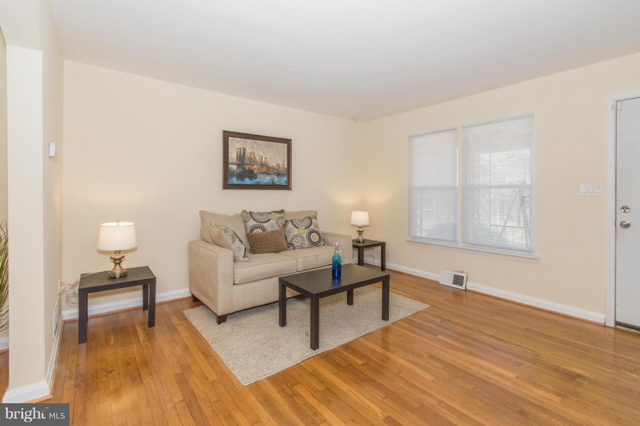 604 Brisbane Road Baltimore, MD 21229 - Photo 3 of 30 a living room with furniture and a wooden floor