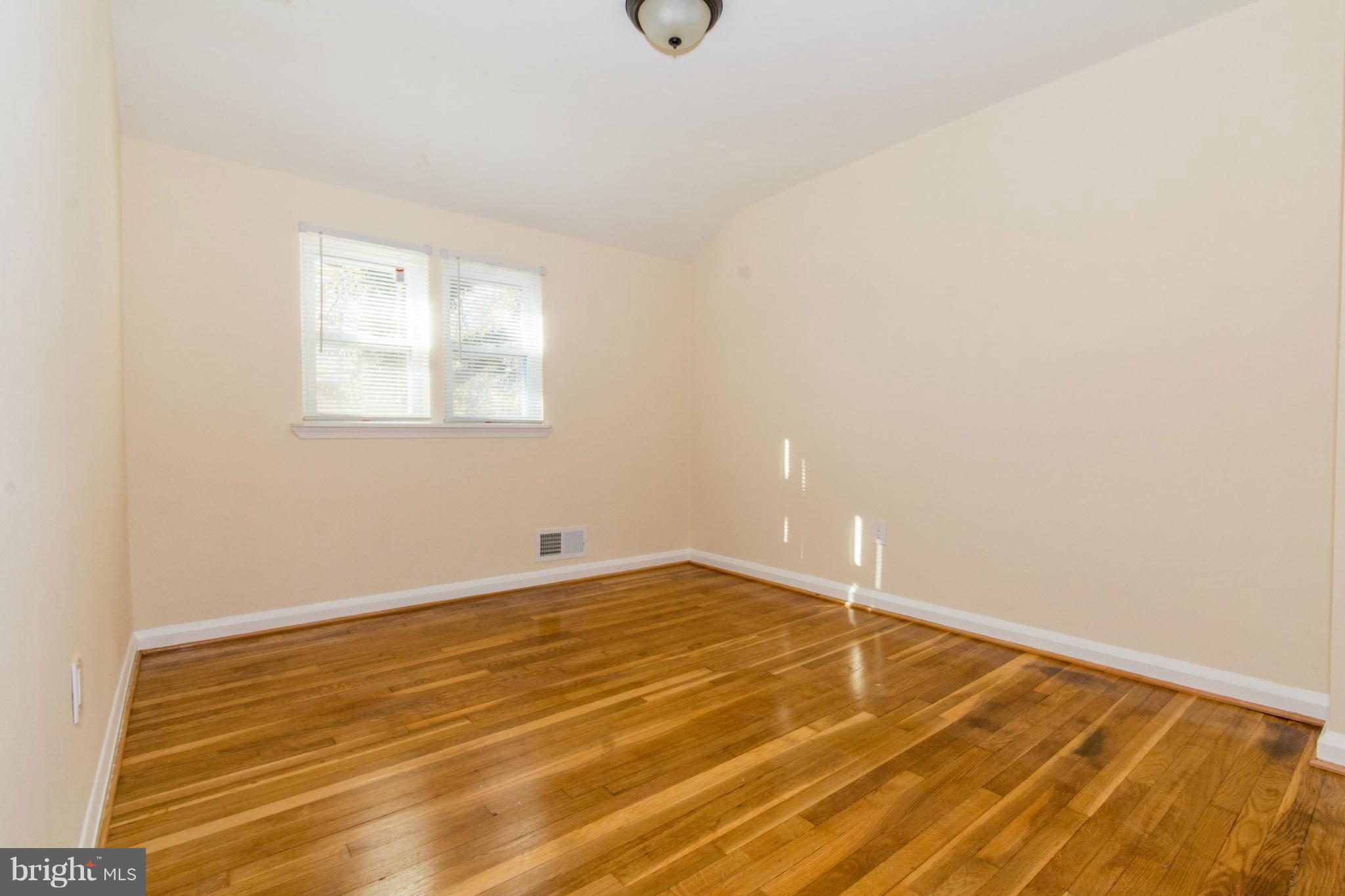 604 Brisbane Road Baltimore, MD 21229 - Photo 22 of 30 a view of empty room with wooden floor