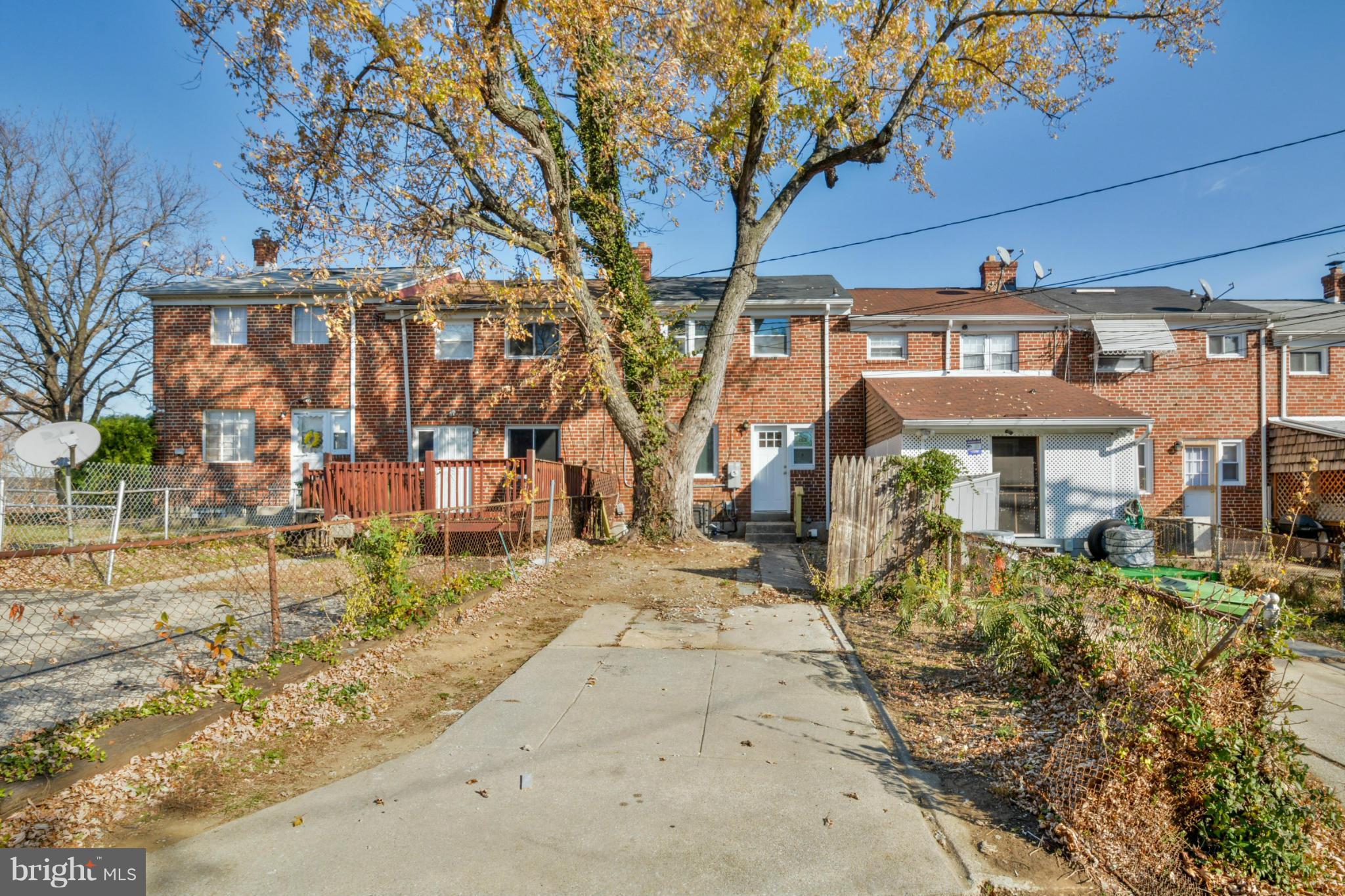 604 Brisbane Road Baltimore, MD 21229 - Photo 29 of 30 front view of a house with a large tree