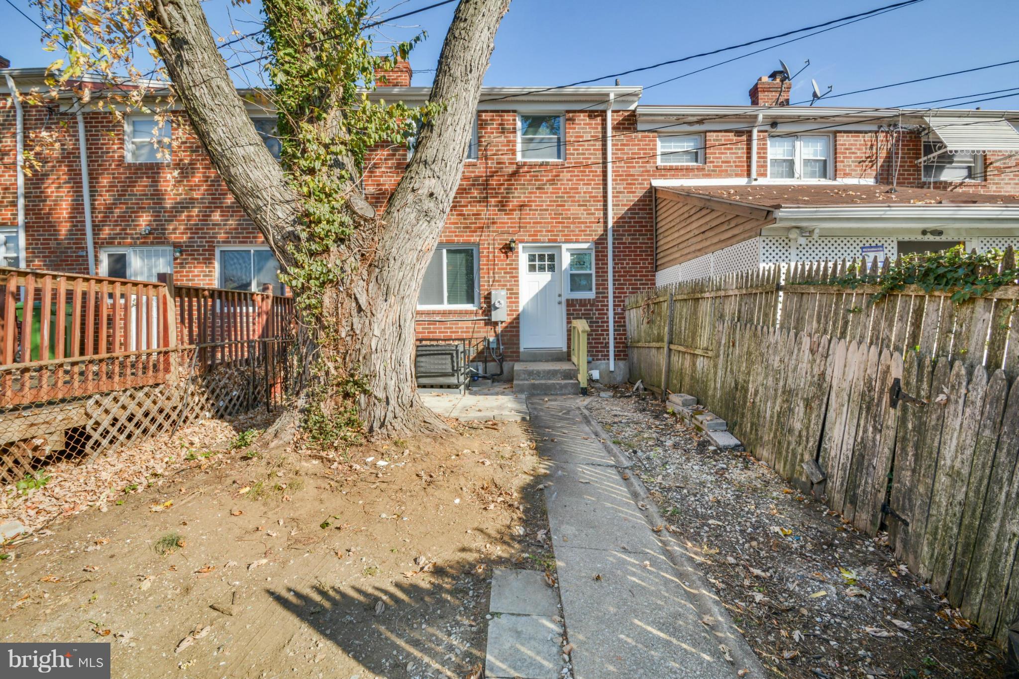 604 Brisbane Road Baltimore, MD 21229 - Photo 30 of 30 a front view of a house with a yard