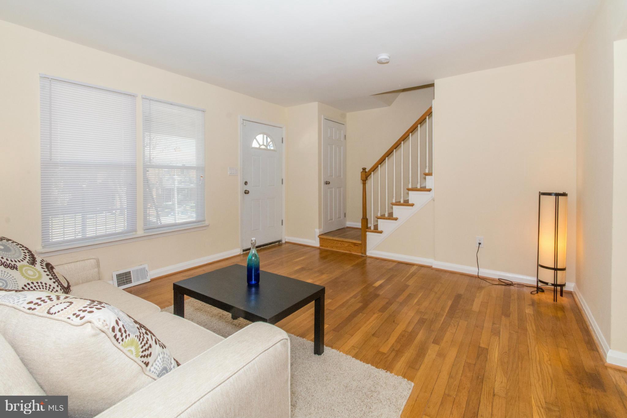 604 Brisbane Road Baltimore, MD 21229 - Photo 4 of 30 a living room with a bed furniture and a window