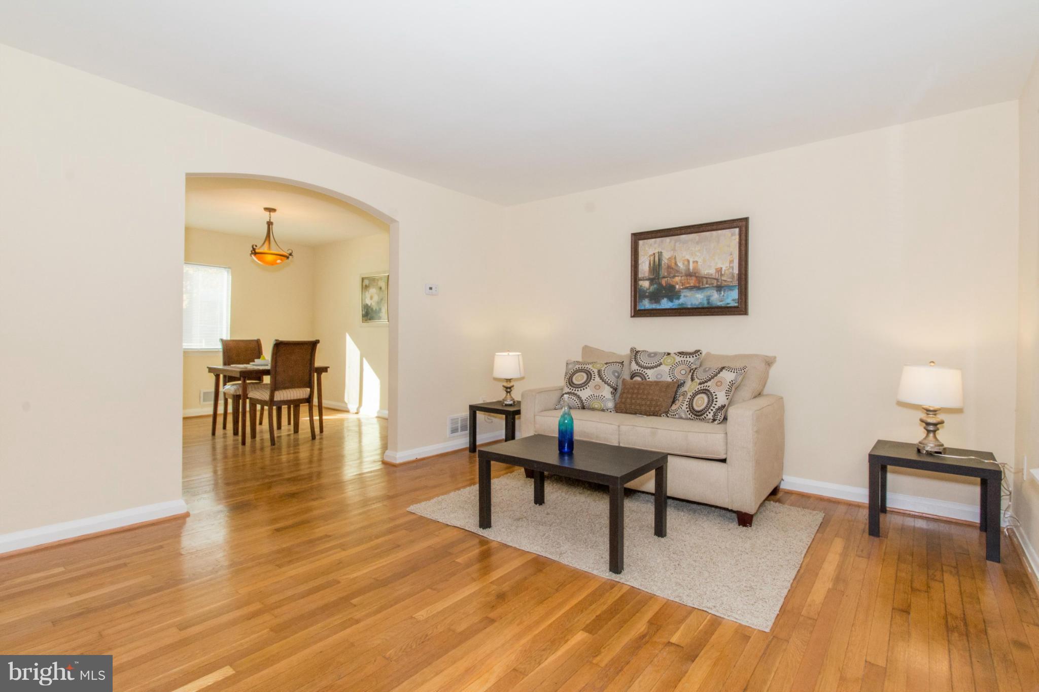 604 Brisbane Road Baltimore, MD 21229 - Photo 5 of 30 a living room with furniture and a wooden floor