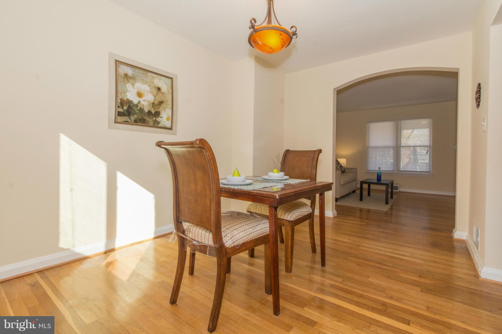 604 Brisbane Road Baltimore, MD 21229 - Photo 6 of 30 a view of a dining room with furniture and wooden floor