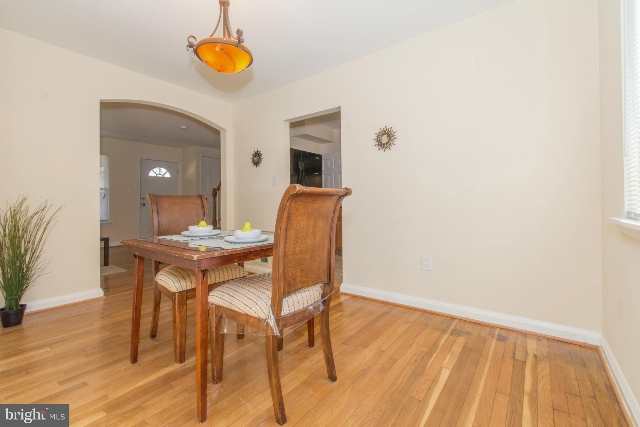 604 Brisbane Road Baltimore, MD 21229 - Photo 8 of 30 a view of a dining room with furniture and wooden floor