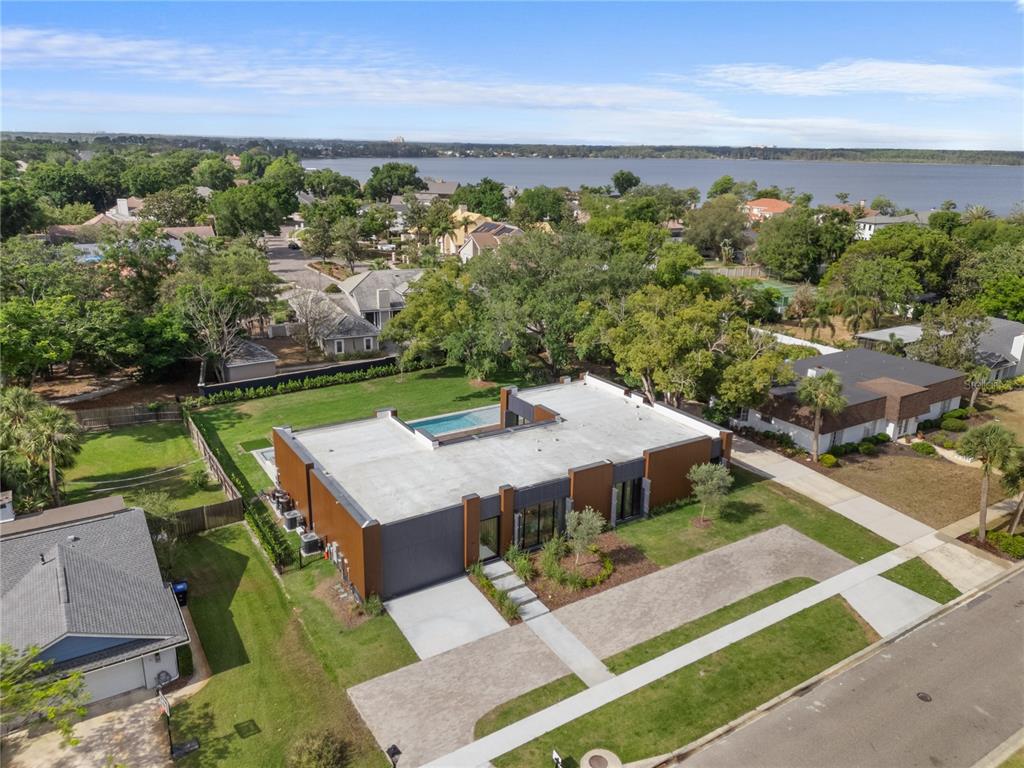 8966 Easterling Drive Orlando, FL 32819 - Photo 3 of 12 an aerial view of a house with a garden