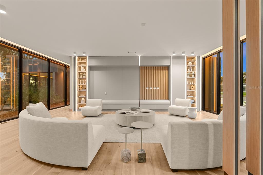 8966 Easterling Drive Orlando, FL 32819 - Photo 10 of 12 a living room with furniture and a large window