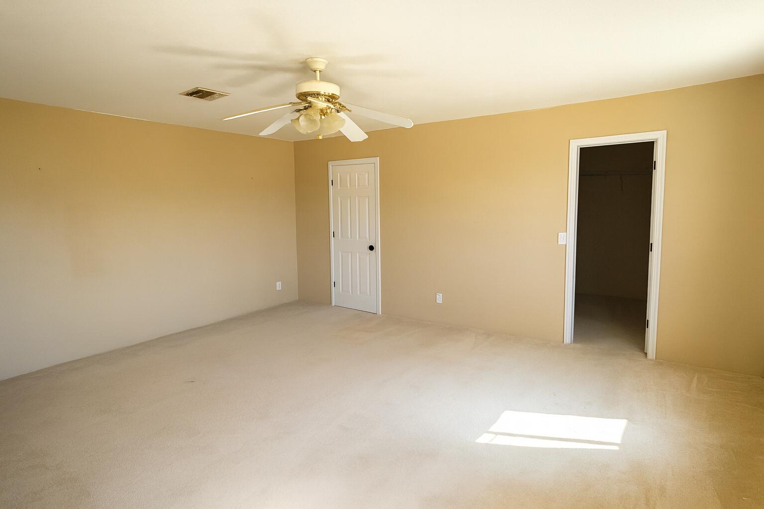 50928 Bell Road Johnson Valley, CA 92285 - Photo 14 of 27 an empty room with a chandelier fan