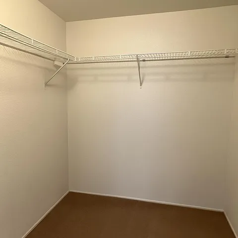 a view of an empty room with windows