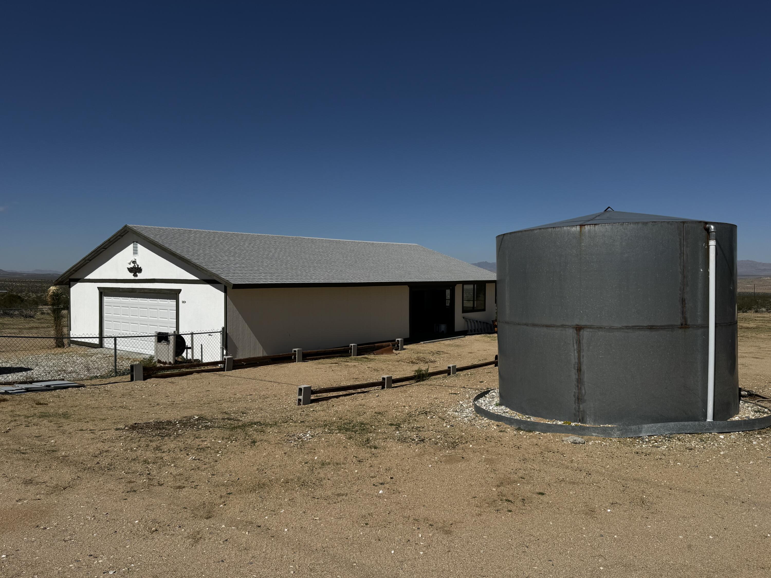 50928 Bell Road Johnson Valley, CA 92285 - Photo 25 of 27 a view of garage and wooden fence