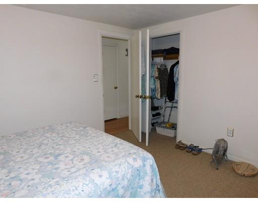 105 Hillcrest Road Waltham, MA 02451 - Photo 13 of 20 a bedroom with a bed and a chair