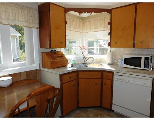 105 Hillcrest Road Waltham, MA 02451 - Photo 5 of 20 a kitchen with a sink cabinets and a window