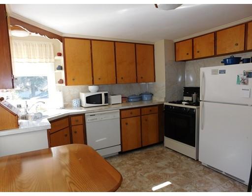 105 Hillcrest Road Waltham, MA 02451 - Photo 6 of 20 a kitchen with a refrigerator stove and sink