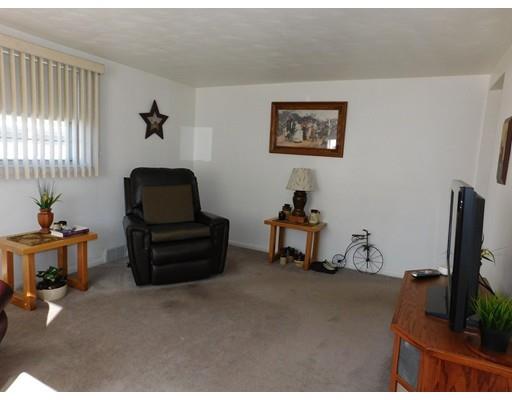105 Hillcrest Road Waltham, MA 02451 - Photo 9 of 20 a room with furniture and a flat screen tv